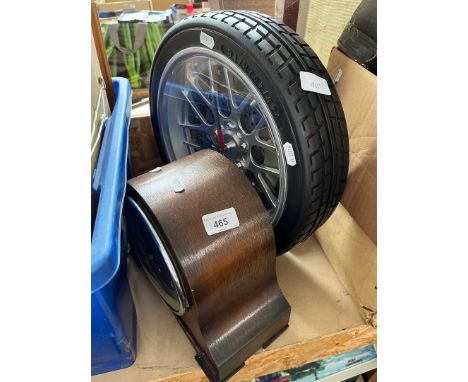 A 1930s oak cased mantle clock and a modern wall clock modelled as a car wheel. 