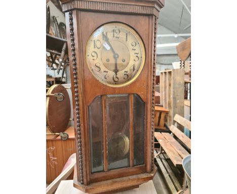 An oak wall clock. 