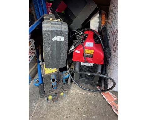 A 2 tonne trolley jack, pressure washer with brush - no lance, a battery display unit and a boxed sander. 