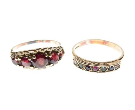 Two 9ct gold dress rings, the first set five graduated red stones, size Q½ approx, the second seven assorted stones, size R a