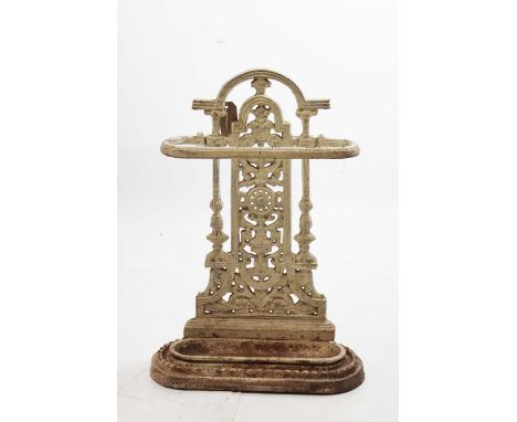 Late 19th or early 20th Century cast iron umbrella or stick stand, with pierced foliate scroll back panel over rectangular dr