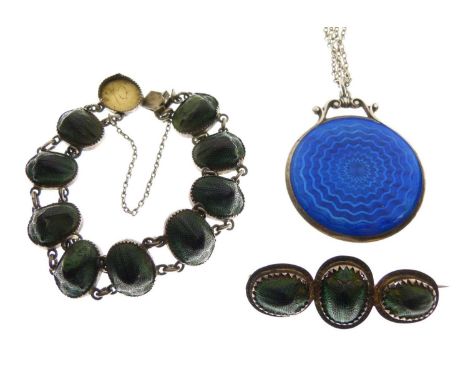 Silver and blue enamel mirror, 4cm diameter, on chain, together with a scarab beetle bracelet and brooch, (3)