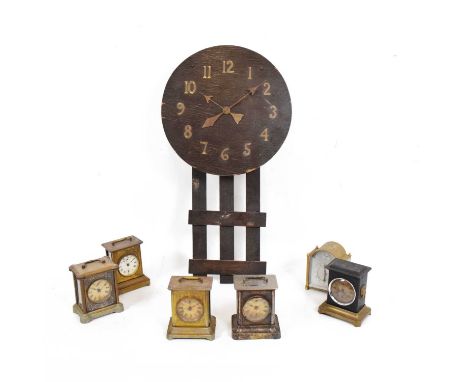 American Arts &amp; Crafts / Mission-style oak wall clock, 75cm high, together with a group of musical alarm clocks, all with