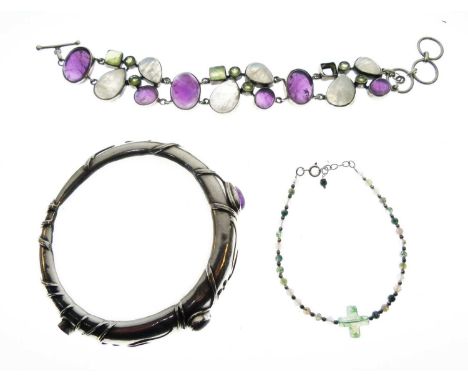 Three semi-precious stone set bracelets (a/f), comprising a bangle with entwined vine leaf decoration, a bracelet set amethys