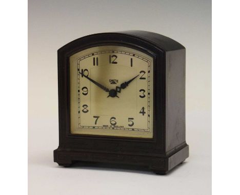 Smiths Bakelite alarm clock with arched cream dial having black Arabic numerals, 10cm x 12cm high 