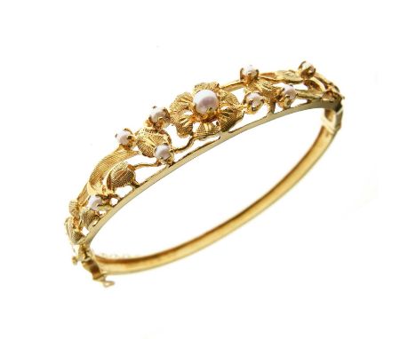 9ct gold snap bangle set seed pearls on textured foliage, 13.3g gross approx
