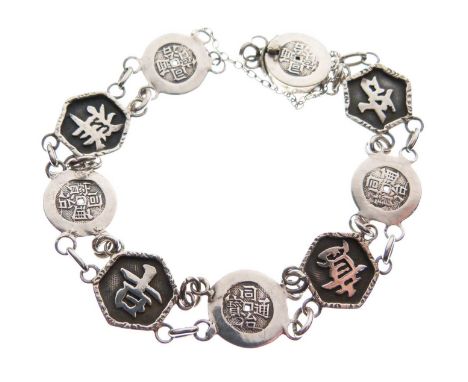 Chinese export silver bracelet, composed of circular and hexagonal panels depicting auspicious Chinese characters, 18cm long 