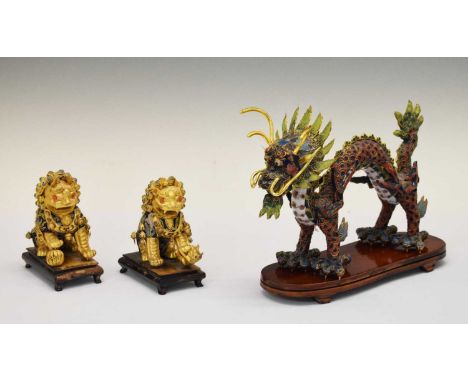Chinese gilt metal and enamel dragon and pair of temple lions, of recent manufacture, 22cm high and smaller