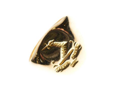 Yellow metal (18ct) signet ring, engraved with a crest, an arm holding a dagger over banner motto 'Esto Fidelis' (Be Faithful
