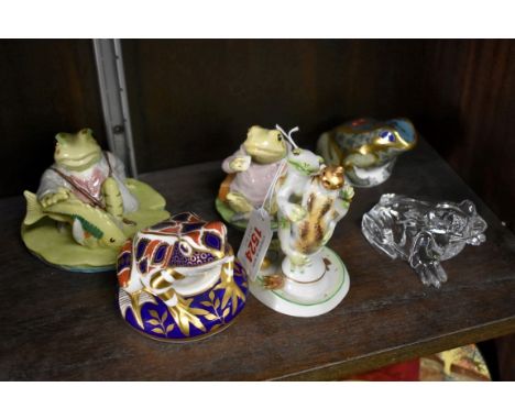 Six ceramic and glass frog models,&nbsp;to include two Royal Crown Derby examples; and another Waterford example.&nbsp; 