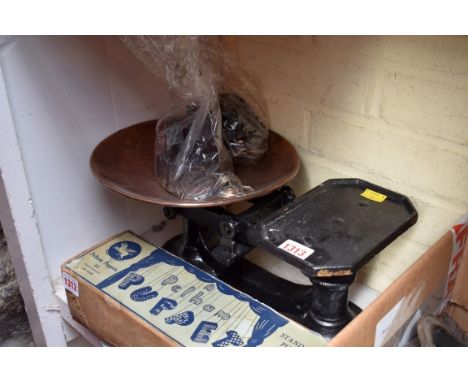A set of old cast iron and copper kitchen scales.&nbsp; 
