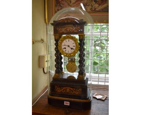 A late 19th century ebonized and inlaid portico clock,&nbsp;46.5cm high, with pendulum, on ebonized stand with glass dome, to