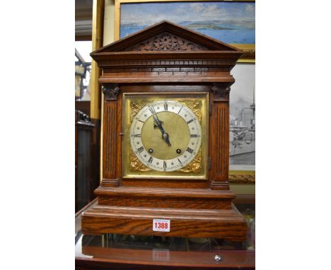 An Edwardian oak architectural mantel clock, 41.5cm high. 