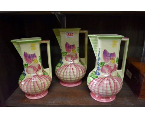 A set of three Myott, Son &amp; Co 'Sweet Seventeen' pattern jugs,&nbsp;largest 22cm high. 