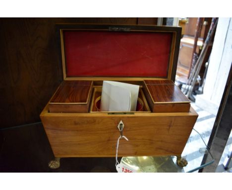 A George III kingwood sarcophagus tea caddy, on gilt brass paw feet,&nbsp;31cm wide.&nbsp;Provenance: Gerald Lewis Antiques. 