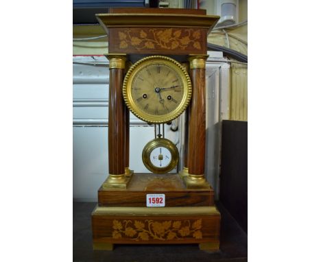 A 19th century rosewood and inlaid portico clock,&nbsp;41.5cm high, with pendulum.&nbsp; 