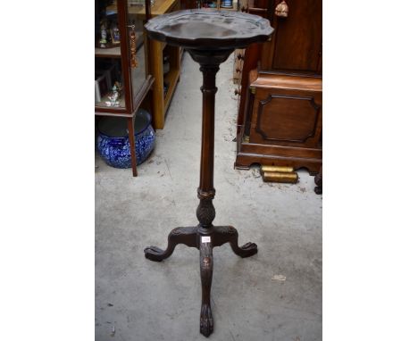 A carved mahogany tripod torchere,&nbsp;103cm high. 