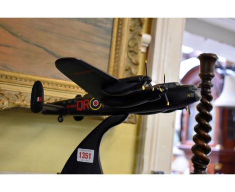 A carved and painted mahogany 1:72 scale model of a Lancaster Mark I aeroplane,&nbsp;by&nbsp;Bravo Delta models, wingspan 43.