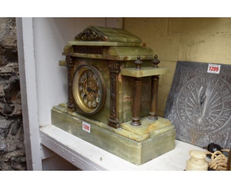 A green onyx architectural mantel clock, 35cm wide.&nbsp; 