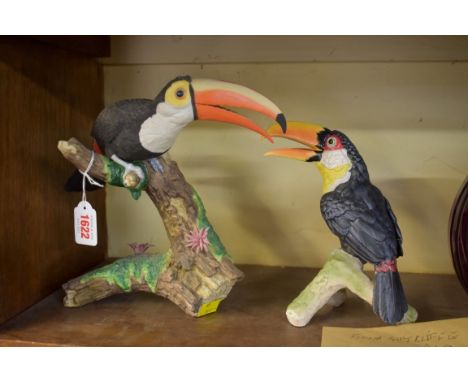A porcelain Toucan,&nbsp;23.5cm high; together with another similar smaller Goebel example. 