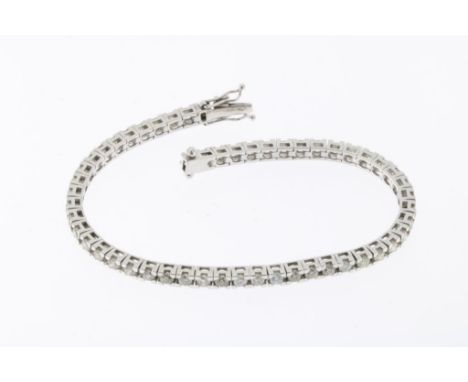 White gold tennis bracelet set with brilliant cut diamonds, total  ca. 3.75 ct, clarity VS-P, colour K-N, 750/000, gross w. 1