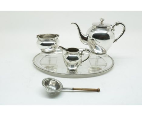 Silver tea service on tray with beaded edge, Dutch import mark D.  Aubert, gross w. 1648 gr., width tray 37.5 cm. Dent in the