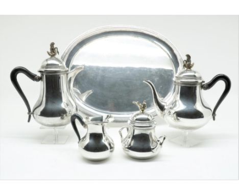 Silver tea and coffee service on oval tray, with palmet decorated  edge, gilded swan finals and ebony handles, import mark D.