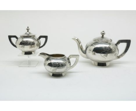 silver tea service engraved with a dragon, Chinese, 850/000,  gross w. 889 gr., height teapot ca. 14 cm. Sugar and milk jug  