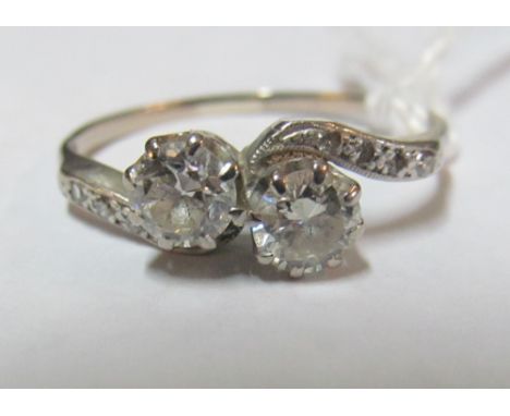 A two stone diamond cross over ring