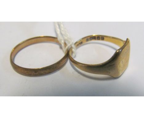 A 9ct gold signet ring 2.1g and a metal core ring