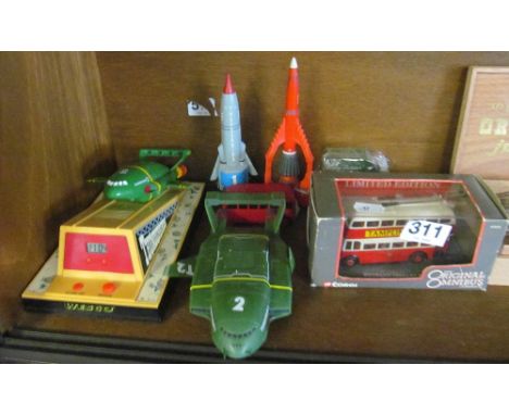 A Thunderbirds model alarm clock, three other Thunderbirds models and a few other cars