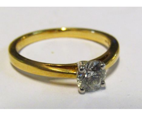 An 18ct half carat diamond ring 3.8g