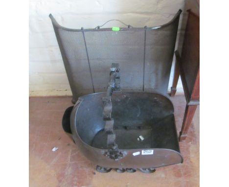 A coal scuttle and a firescreen