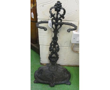 A black metal stick stand