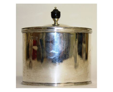 A plain oval tea caddy with hinged top and ebony finial. Sheffield 1923. Weight 8ozs.