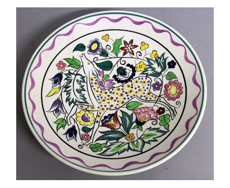 A POOLE POTTERY CIRCULAR DISH by N. BLACKMORE, colourful deer. Signed on reverse. 10.25ins diameter.