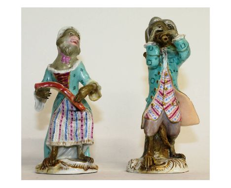 A small pair of Meissen monkey musicians, one holding a sheet of music, the other playing a recorder. Cross swords mark in bl