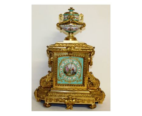 A very good quality Louis XVI ormolu and pink Sevres clock, the dial with a pink porcelain panel, painted with figures, eight