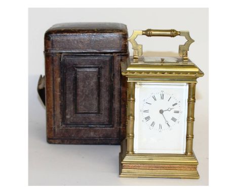 A good large 19th century French brass repeater carriage clock, in original leather carrying case. 6.5ins high.