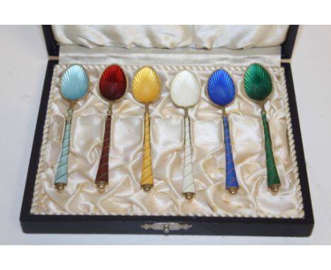 A set of six Danish silver gilt and enamel coffee spoons, .925, in a fitted case.