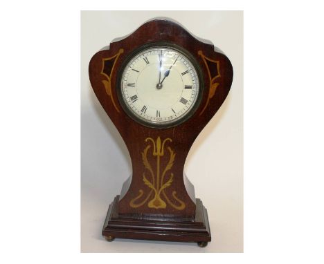An Edwardian mahogany balloon shaped mantle clock, on four ball feet.  10ins.