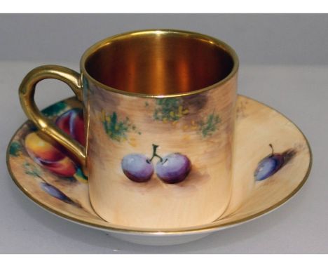 A Royal Worcester fruit painted coffee can and saucer, both signed by Roberts, black mark.
