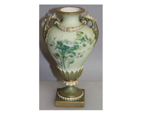 A Royal Worcester two handled vase, painted with flowers on a blush green ground, puce mark.