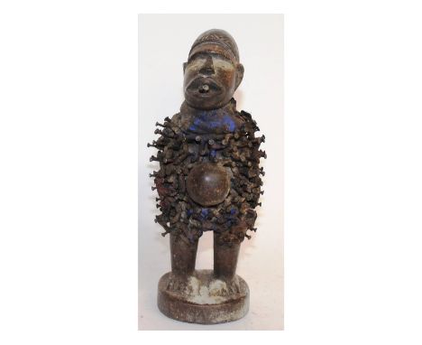 A rare tribal fetish wooden figure with NALLI. 10.5ins high.