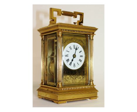 A good 19th century French brass carriage clock, retailed by Charles Frodsham, with four column supports and repeat action.  