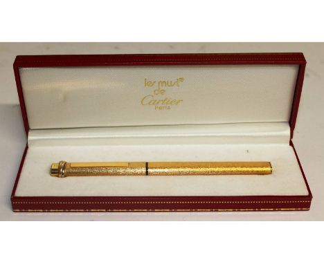 Cartier " Must de Cartier Vendome" fountain pen, c. 1983, with gold-plated body, 18ct solid gold nib, retractable button-oper