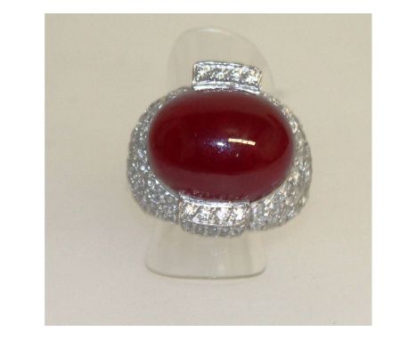 A superb 18ct white gold and cabochon ruby pave set ring.