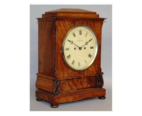 A 19th century mahogany bracket clock by Griffith, with white dial, eight day movement, striking on a single bell with bun fe