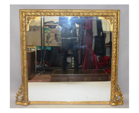 A 19th century style gilt framed overmantle mirror with acorn and oak leaf carved decoration.  4ft 4ins wide x 3ft 10ins high