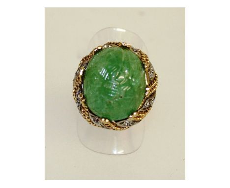 A superb carved jade and diamond ring, set in 18ct yellow gold.